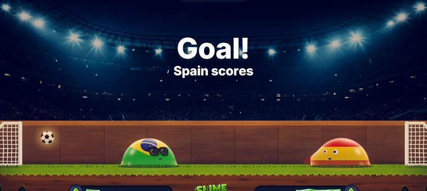A goal under the floodlights of the night arena: GOAL! Spain scores, as a Brazil-flag slime in sunglasses and a Spain-flag slime stand on the pitch.